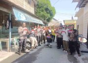 Polsek TBS Bagikan Bendera Merah Putih Jelang HUT RI ke-80